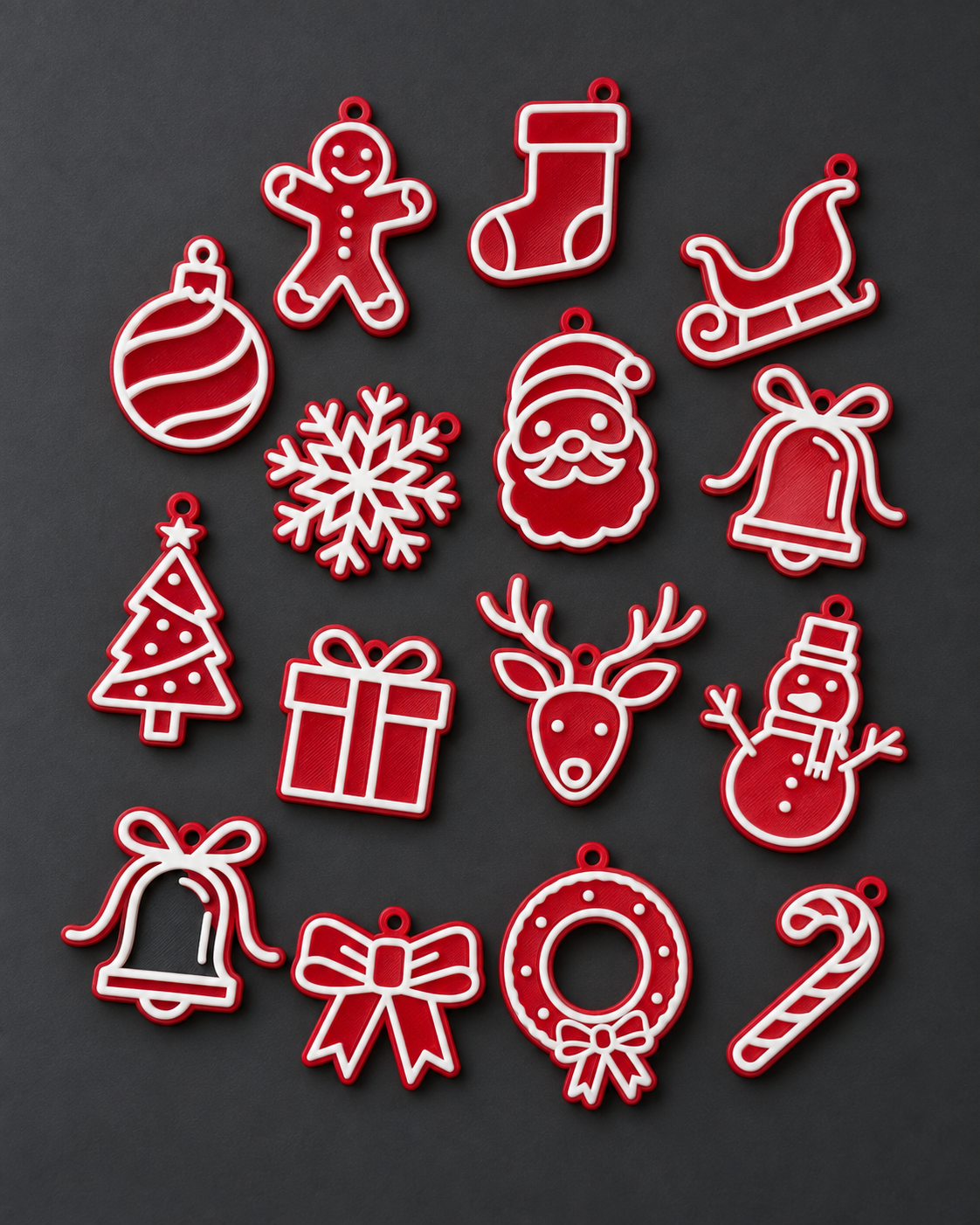 Quinze enfeites de Natal vermelhos com contorno branco impressos em 3D sobre fundo grafite.
